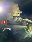 Brandeinsatz für den THW-Bagger (Bild: Tobias Förg/THW Augsburg)